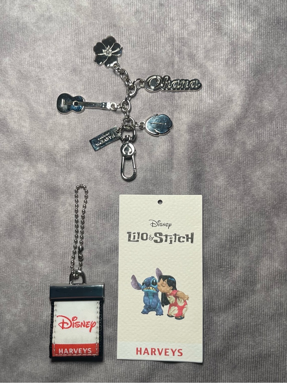 Harveyโs seatbelt Disney Stitch ohana hibiscus charm and hangtags